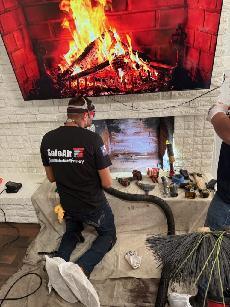 Professional chimney cleaning in a residential home in Dallas, ensuring safety and preventing chimney-related dangers.