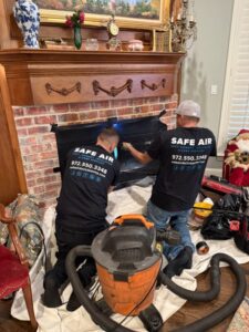 SafeAir technician performing air duct cleaning in Dallas home