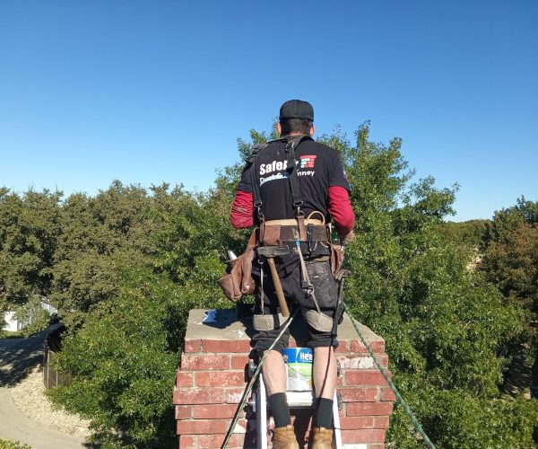 Chimney inspection for a red brick chimney in Arlington, TX, ensuring safety, efficiency, and structural integrity for homeowners.