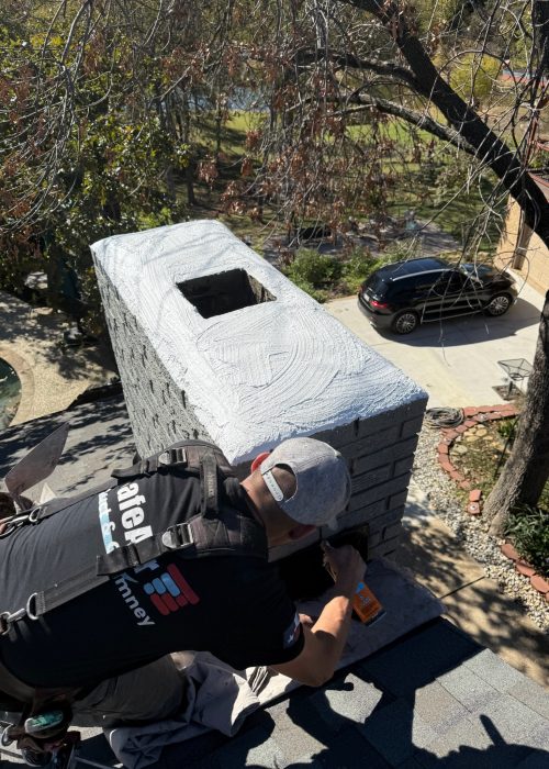 Chimney service company in Arlington performing a crown repair service.