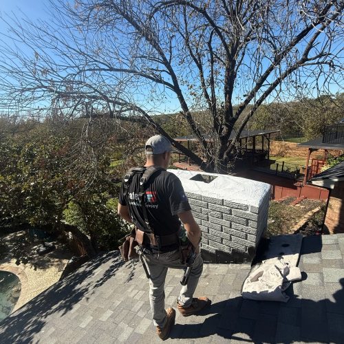 Chimney repair and masonry restoration for a gray brick chimney, enhancing structural integrity and safety.