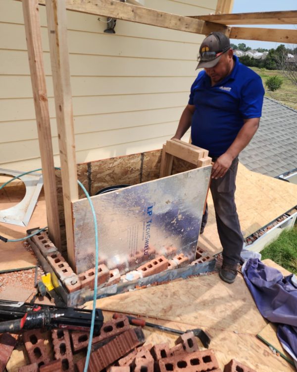 Chimney company rebuilding a chimney from the ground up in Frisco, Texas.