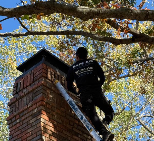 Inspection of a red brick chimney in Arlington, Texas, ensuring safety and structural integrity.