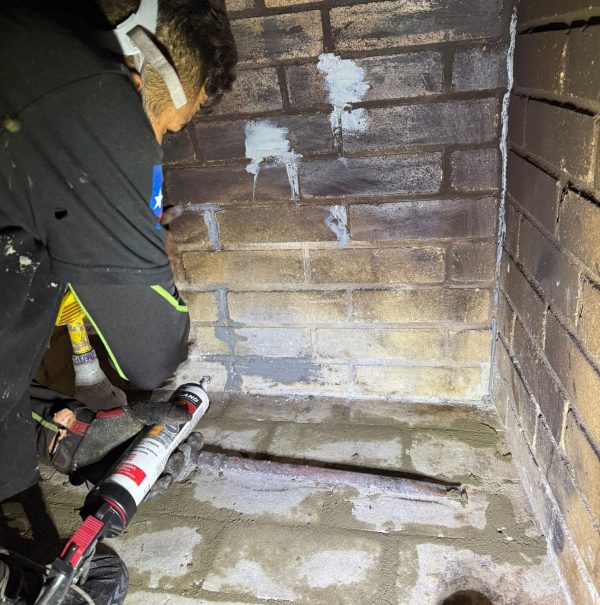 Creosote removal by a chimney expert company in Irving, Texas, ensuring a clean and safe fireplace.